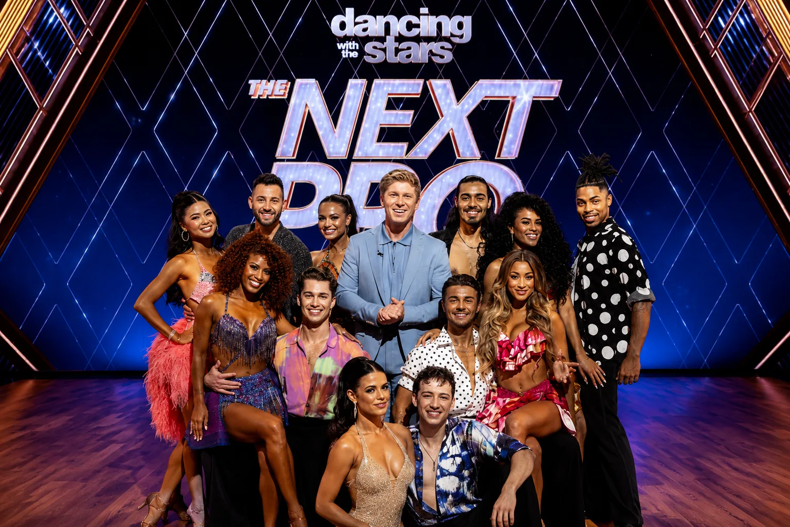 Cast of Dancing Pro Search posing on stage during the promotional launch of the Dancing With the Stars spin-off series.